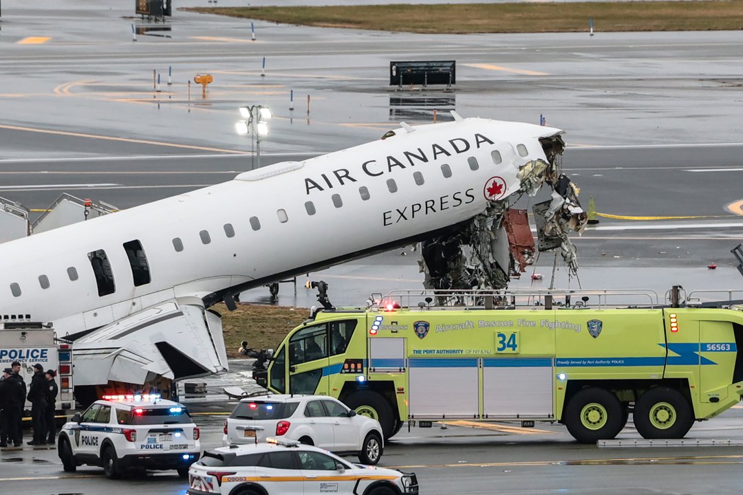 The accident site is seen at LaGuardia Airport after an Air Canada plane collided with a fire truck while landing. | Source: Getty Images