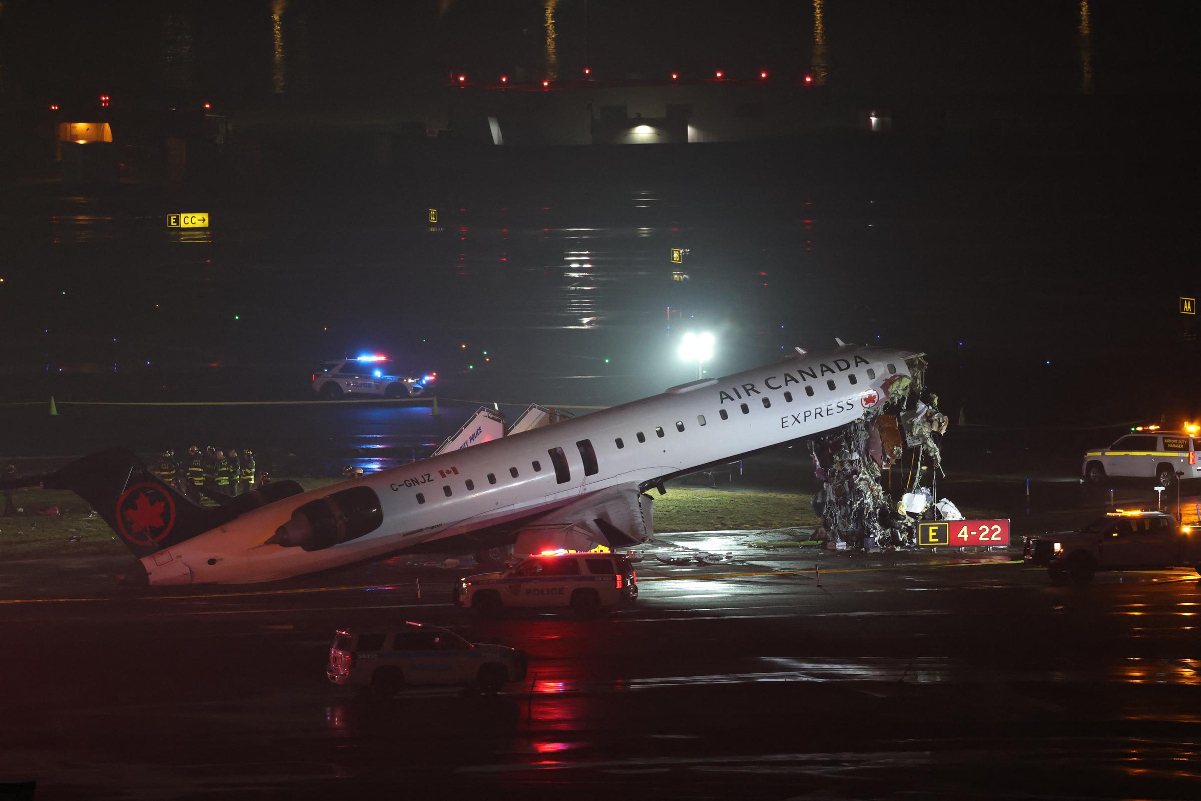 The Air Canada Express plane sits on the runway after colliding with a fire truck at LaGuardia Airport in New York. | Source: Getty Images