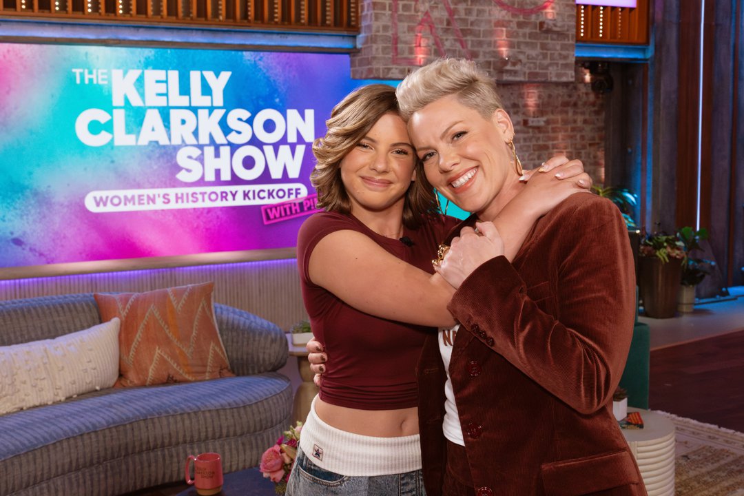 In a second moment from the same appearance, Willow Sage Hart wrapped her arm around Pink in a warm embrace, the pair beaming as they posed together on stage. With their coordinated burgundy tones and matching smiles, the affectionate snapshot captured not only a television booking, but a genuine mother-daughter bond unfolding in real time.