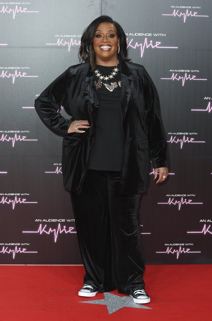 Looking sleek and stylish, Hammond hits the red carpet at the Royal Albert Hall for 