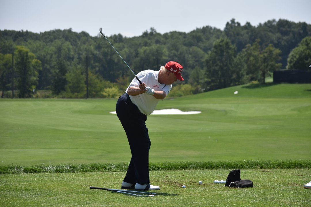 Donald Trump plays golf at the driving range at the LIV Golf Bedminster Event in Bedminster, New Jersey on August 9, 2023. | Source: Getty Images