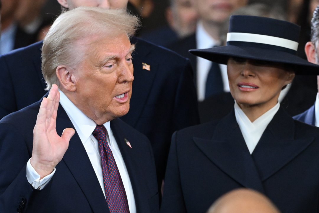 Donald Trump is sworn into office as Melania Trump holds the Bible in the US Capitol Rotunda in Washington, D.C., on January 20, 2025. | Source: Getty Images