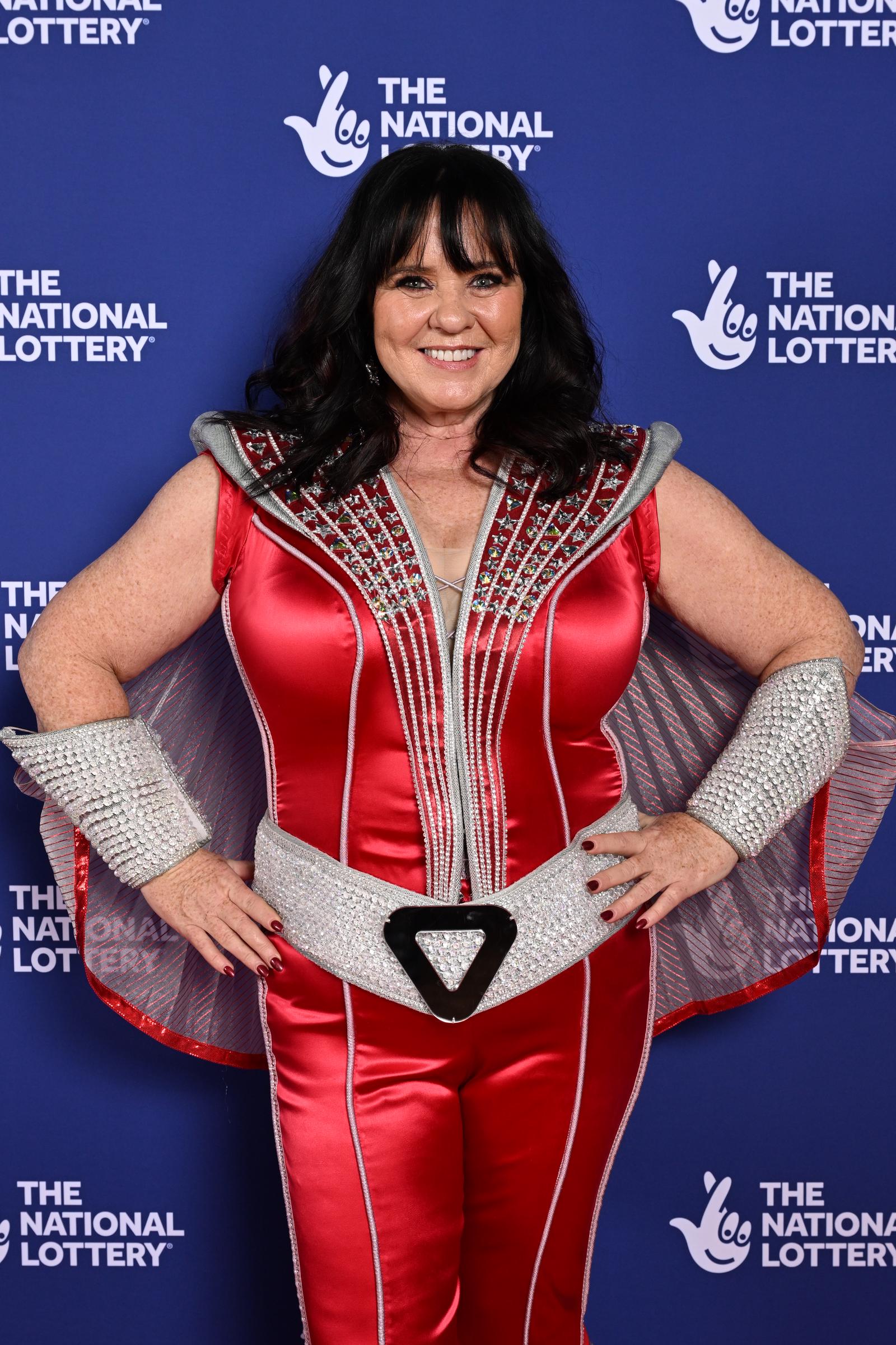 Nolan embraced festive flair at The National Lottery New Year's Eve Big Bash 2024 at OVO Arena Wembley on 4 December. She dazzled in a red satin jumpsuit with silver embellishments, structured shoulders, and a metallic belt &mdash; topped off with glittering cuffs and a flowing cape.