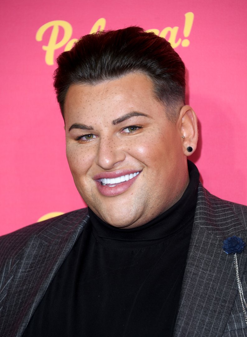 Potts lights up the room at ITV Palooza 2019, flashing a megawatt smile at London's Royal Festival Hall on 12 November. Dressed in a sleek dark pinstripe blazer over a black high-neck top, he keeps things chic and sharp with minimal accessories and perfectly styled hair.