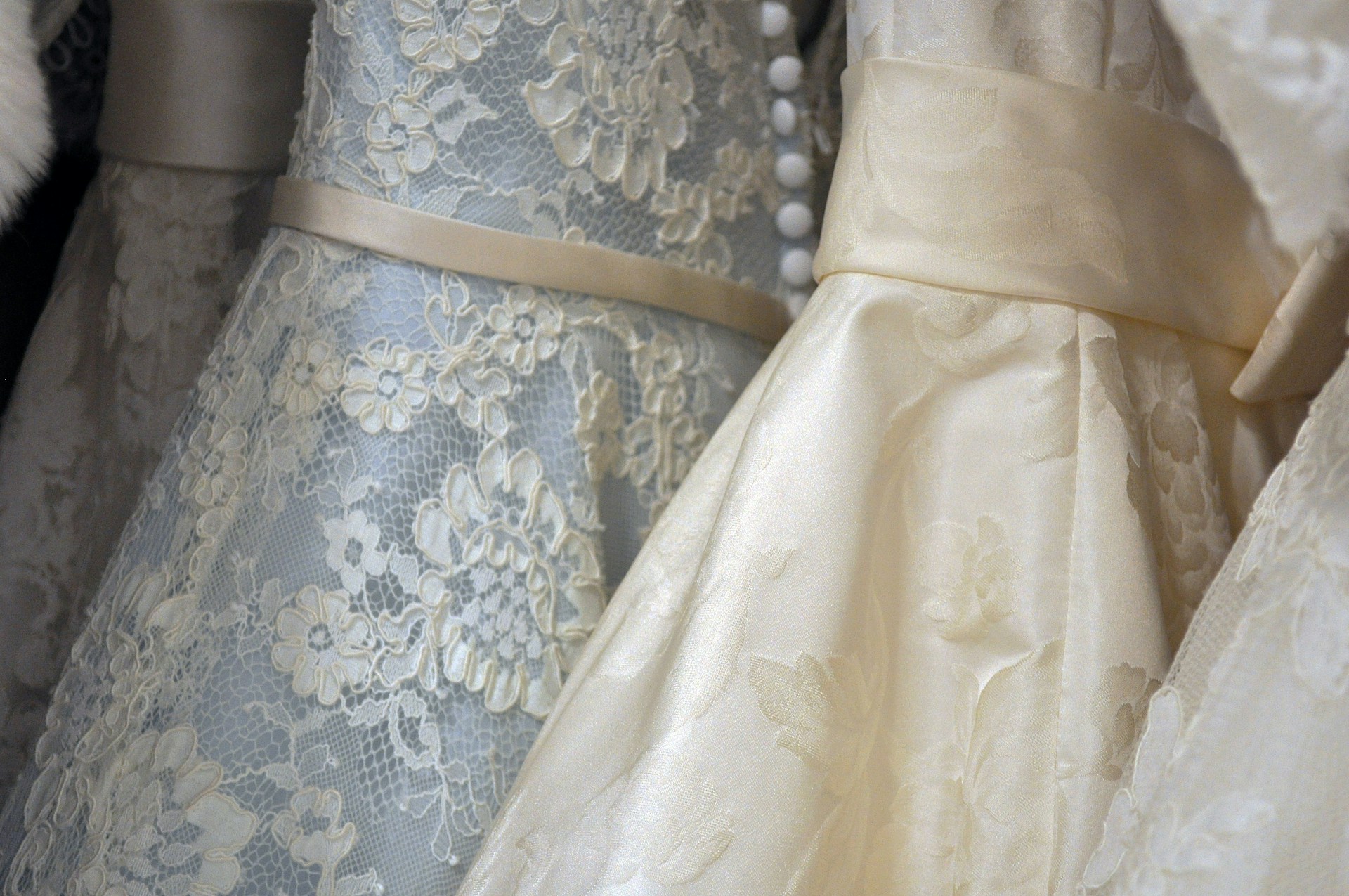 Fine lace dresses on a display | Source: Unsplash