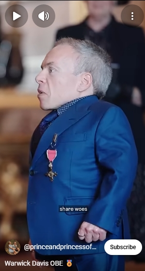 Warwick Davis stands proudly in a royal blue suit inside Windsor Castle, his newly awarded OBE medal gleaming on his chest. The image captures a moment of quiet pride for the 56-year-old actor, whose more than four decades of service to drama and charity earned him a place on King Charles III's New Year's Honours list for 2026. | Source: YouTube/The Prince and Princess of Wales