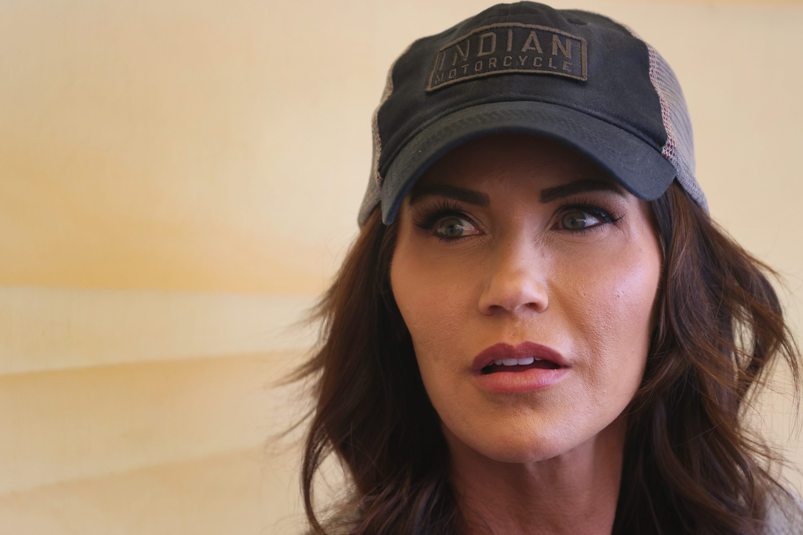 Kristi Noem speaks to reporters at the Sturgis Buffalo Chip campground after riding in the Legends Ride for charity on August 9, 2021, near Sturgis, South Dakota | Source: Getty Images