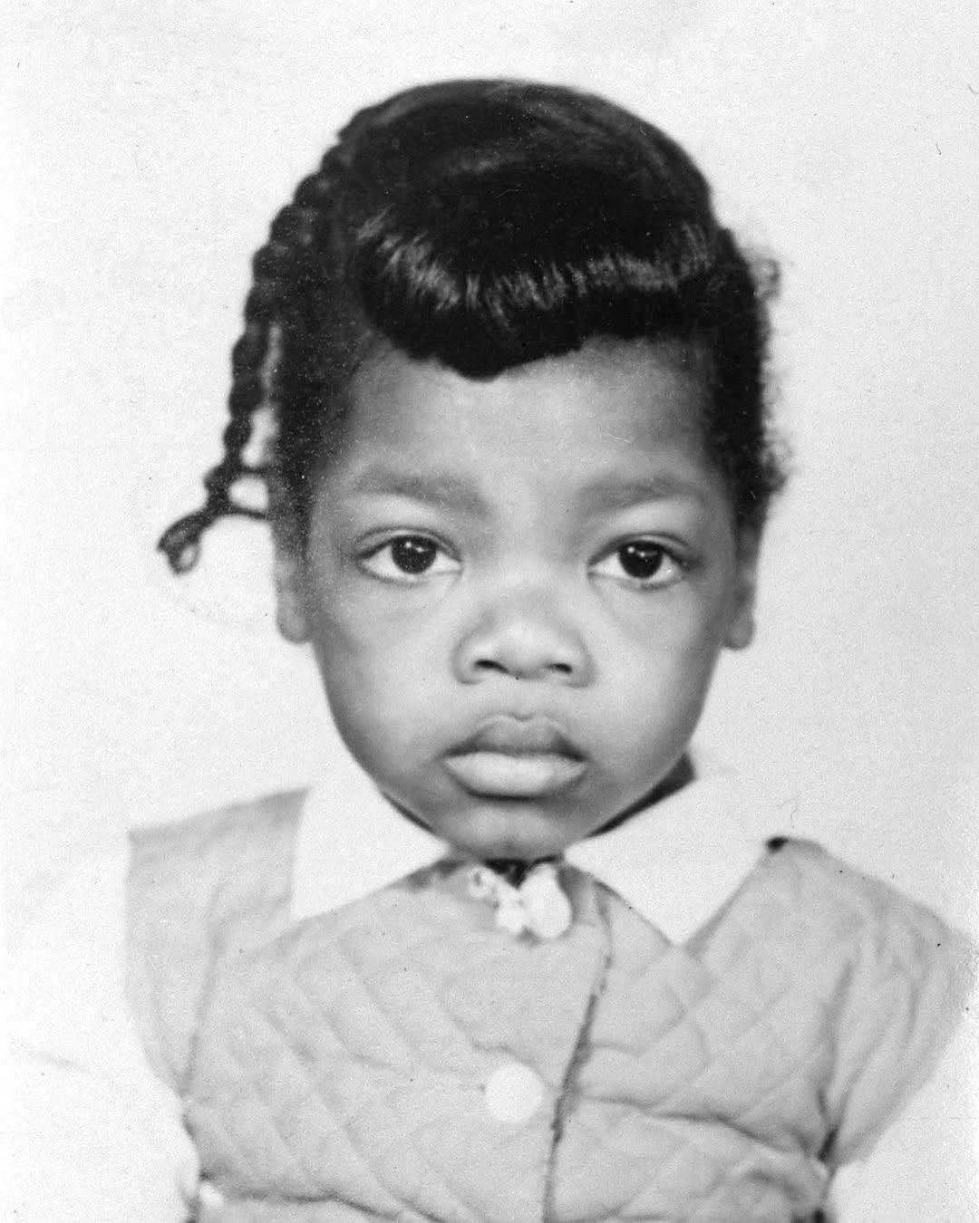 The legendary TV host as a young girl in a throwback photo posted on April 27, 2021 | Source: Instagram/oprah
