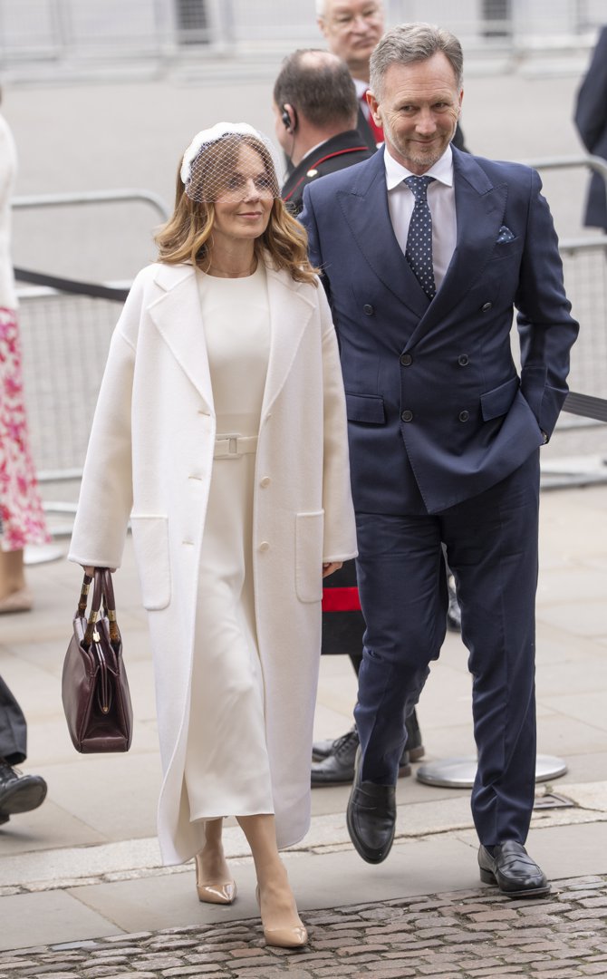Geri Halliwell-Horner turned heads in a floor-length cream coat layered over a matching belted dress, a white netted headpiece and nude patent heels completing the look, as she and Christian Horner made their way into Westminster Abbey for the Commonwealth Day service on 9 March 2026, their appearance alone enough to set social media alight.