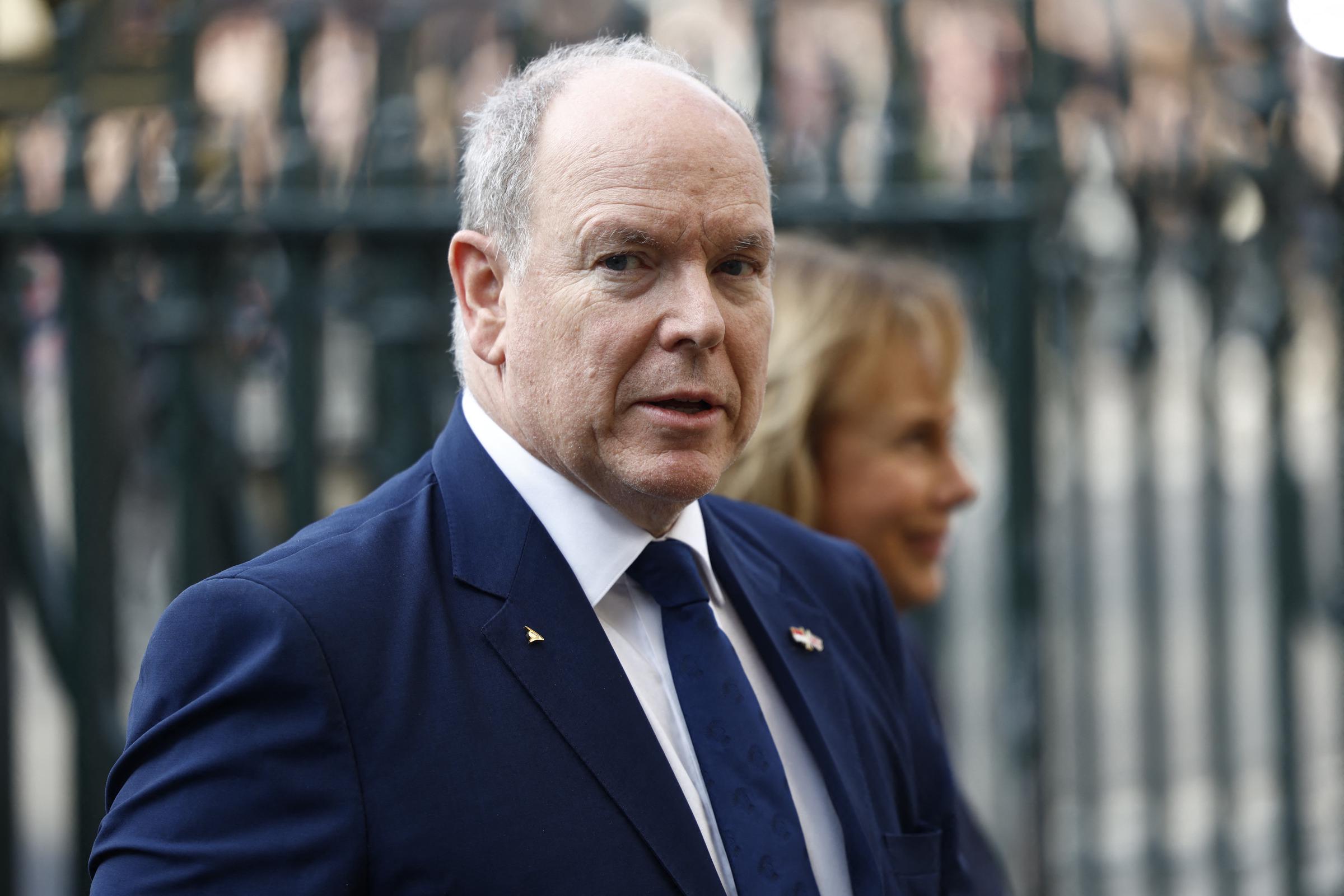 Prince Albert II of Monaco arrived at Westminster Abbey on 9 March 2026 in a sharp navy suit and matching tie, a small gold lapel pin and Monaco flag badge on his chest, joining an array of world dignitaries gathered in central London for the Commonwealth Day service at King Charles's invitation.