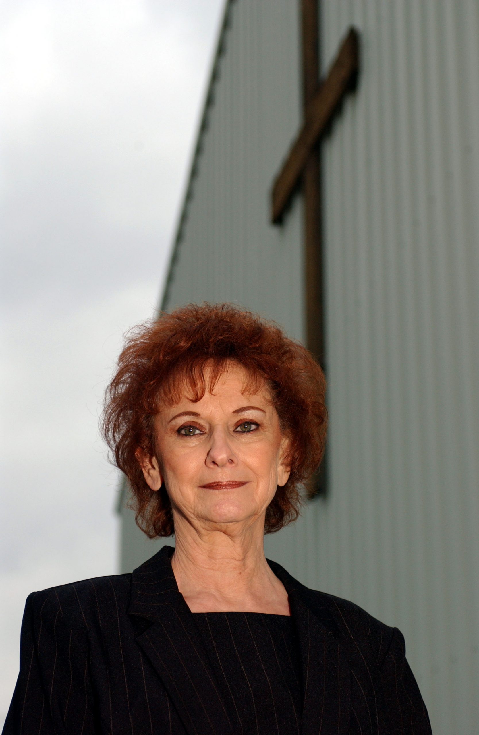 Betty Kresin, the grandmother of rap star Eminem, poses outside of a church following a memorial service for her son, Todd Nelson Sr., on October 22, 2004, in St. Joseph, Missouri. | Source: Getty Images
