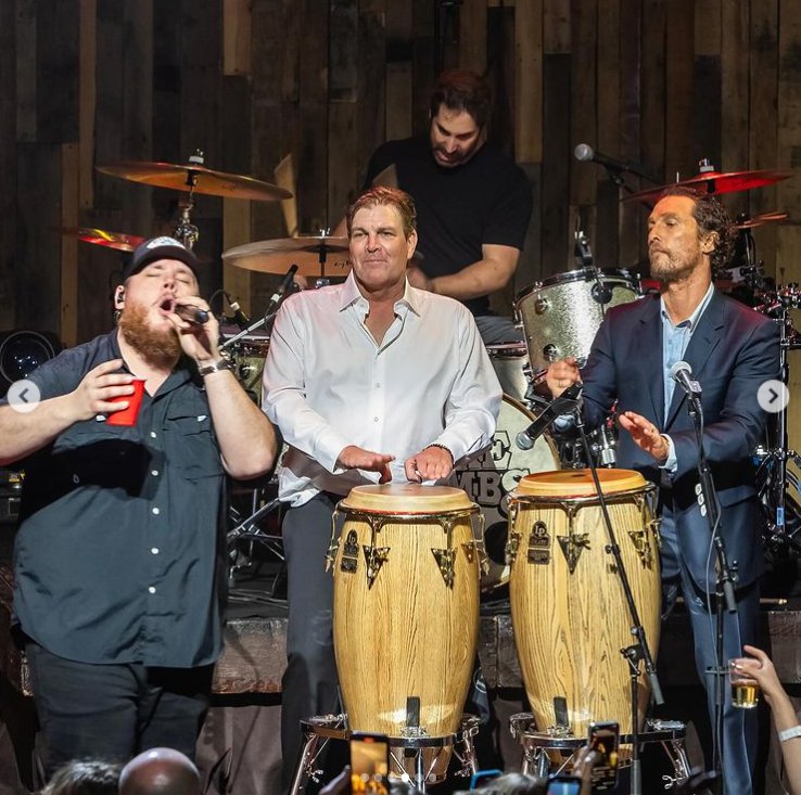 Luke Combs and Matthew McConaughey singing onstage with a band, in a photo shared on Instagram in April 2024. | Source: Instagram/officiallymcconaughey