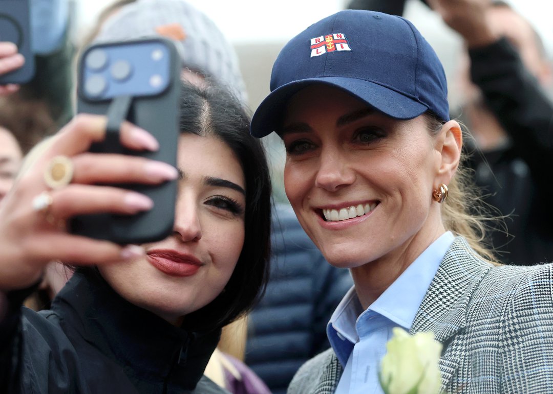 Catherine, Princess of Wales poses with a well-wisher for a photograph during a visit to the RNLI Tower Station on 12 March 2026 in London, England. | Source: Getty Images