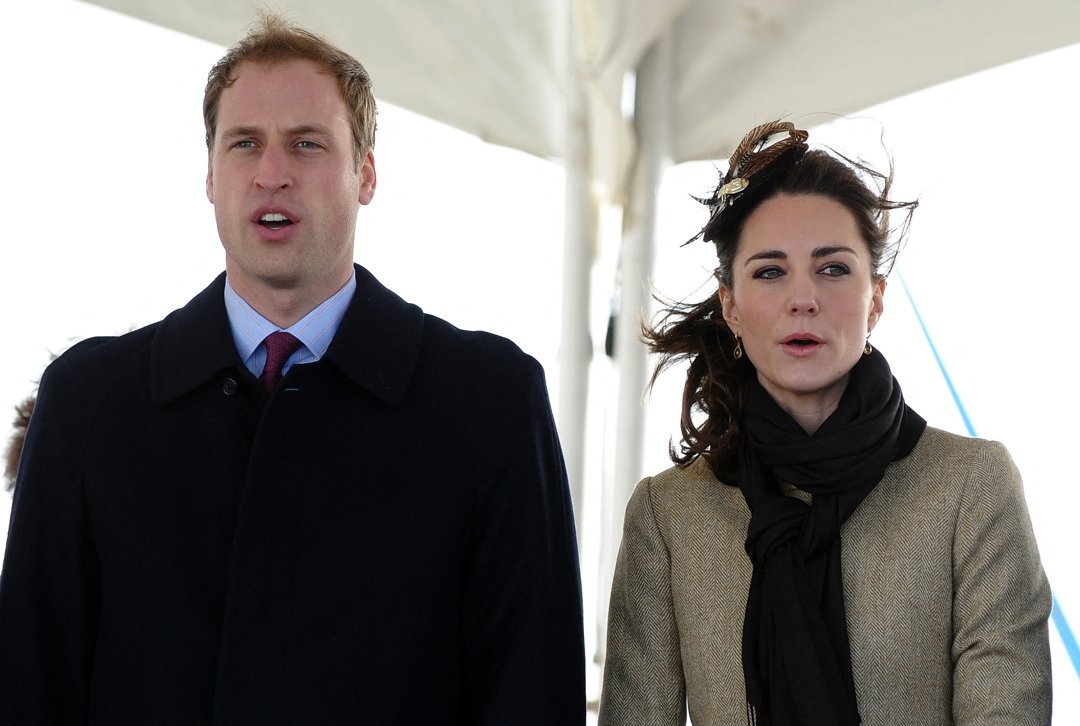 Prince William, Prince of Wales and Catherine, Princess of Wales sing the national anthem during a visit to a RNLI Lifeboat Station in Anglesey, near Bangor, on 24 February 2011 in Wales.  | Source: Getty Images