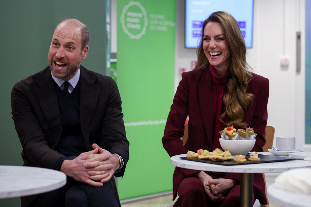 Prince William looks on as Catherine, Princess of Wales, speaks with healthcare staff during a visit to Charing Cross Hospital in west London on 8 January 2026, to highlight the work of NHS staff and volunteers. | Source: Getty Images