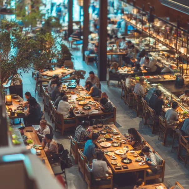 People enjoying their meals at a restaurant | Source: Midjourney