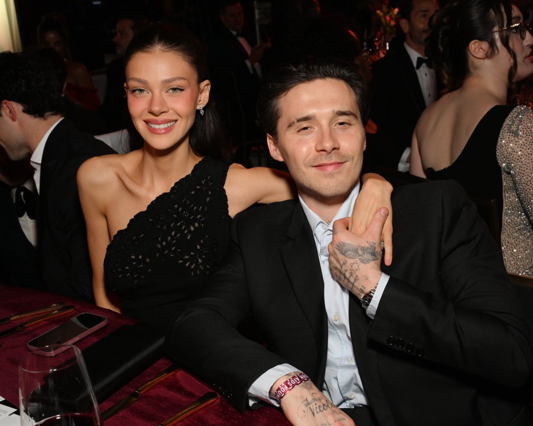 Brooklyn Peltz Beckham, 27, and his wife, Nicola Peltz Beckham, were photographed together at the Elton John AIDS Foundation's 34th Annual Academy Awards Viewing Party on 15 March 2026 in  California, United States &mdash; an event hosted by Brooklyn's godfather, Sir Elton John, amid the couple's ongoing rift with the Beckham family. Nicola wore a black one-shoulder crochet dress, her dark hair worn down, while Brooklyn donned a black suit over an open-collar shirt.