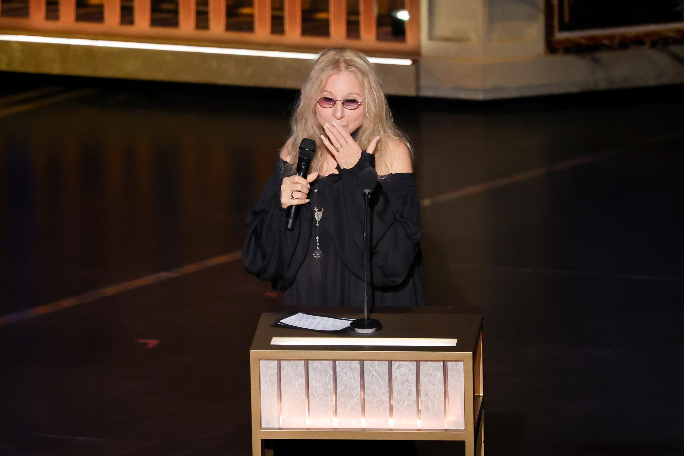 Barbra Streisand blows a kiss while standing at the podium during the 98th Academy Awards | Source: Getty Images