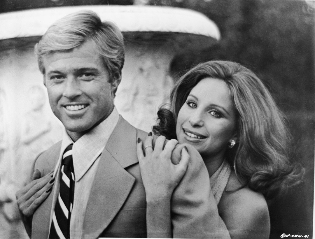Barbra Streisand hugging Robert Redford in a still from their movie, 