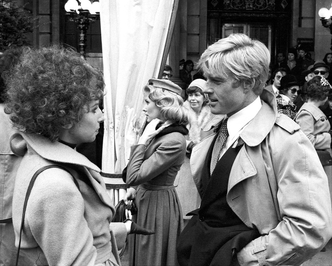 Barbra Streisand and Robert Redford looking at each other during the filming of the movie in 1973. | Source: Getty Images