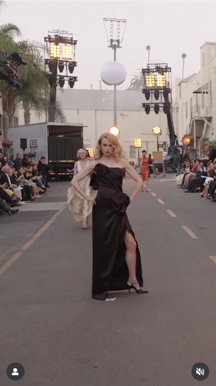 Nicole Kidman commands the runway with striking confidence, posing gracefully in her sleek black gown, as seen from a post dated October 27, 2025. | Source: Instagram/voguemagazine