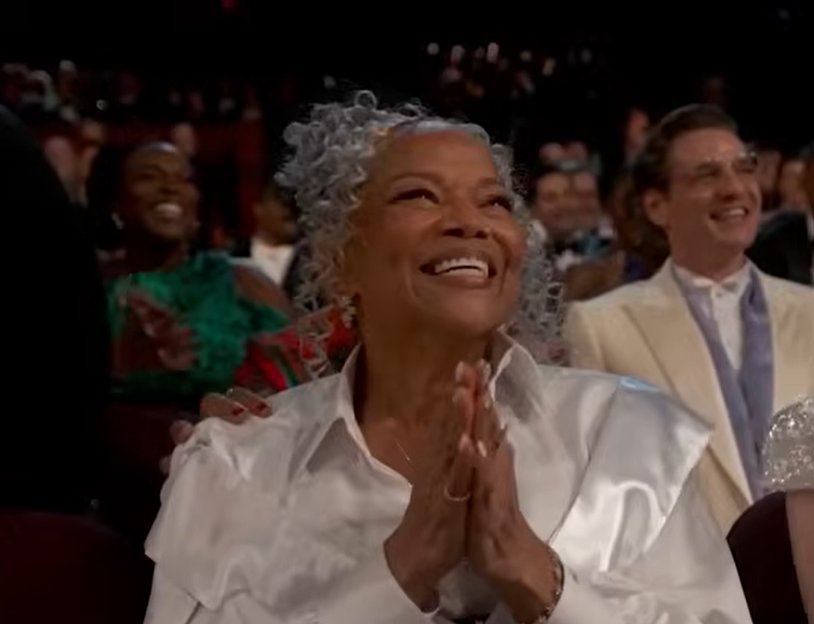 Donna Jordan smiles proudly, her silver curls framing her face as she clasps her hands together while watching the moment unfold. | Source: YouTube/ABCNews