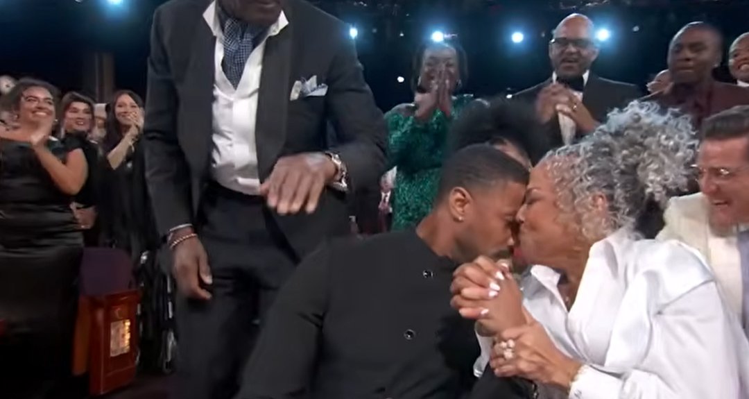 Donna Jordan presses a heartfelt kiss to her son&rsquo;s face while holding his hand as the room erupts around them. | Source: YouTube/ABCNews