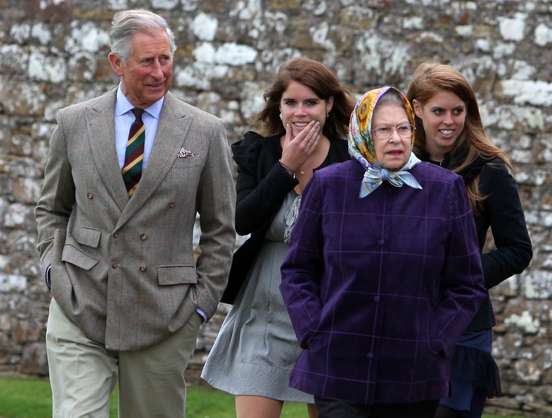 Queen Elizabeth II (R) accompanied by King Charles III (L), Princess Eugenie, (C), Princess Beatrice arrive at the Castle of Mey after a private family holiday around the Western Isles of Scotland, on 2 August 2010 in Scrabster, Scotland. | Source: Getty Images